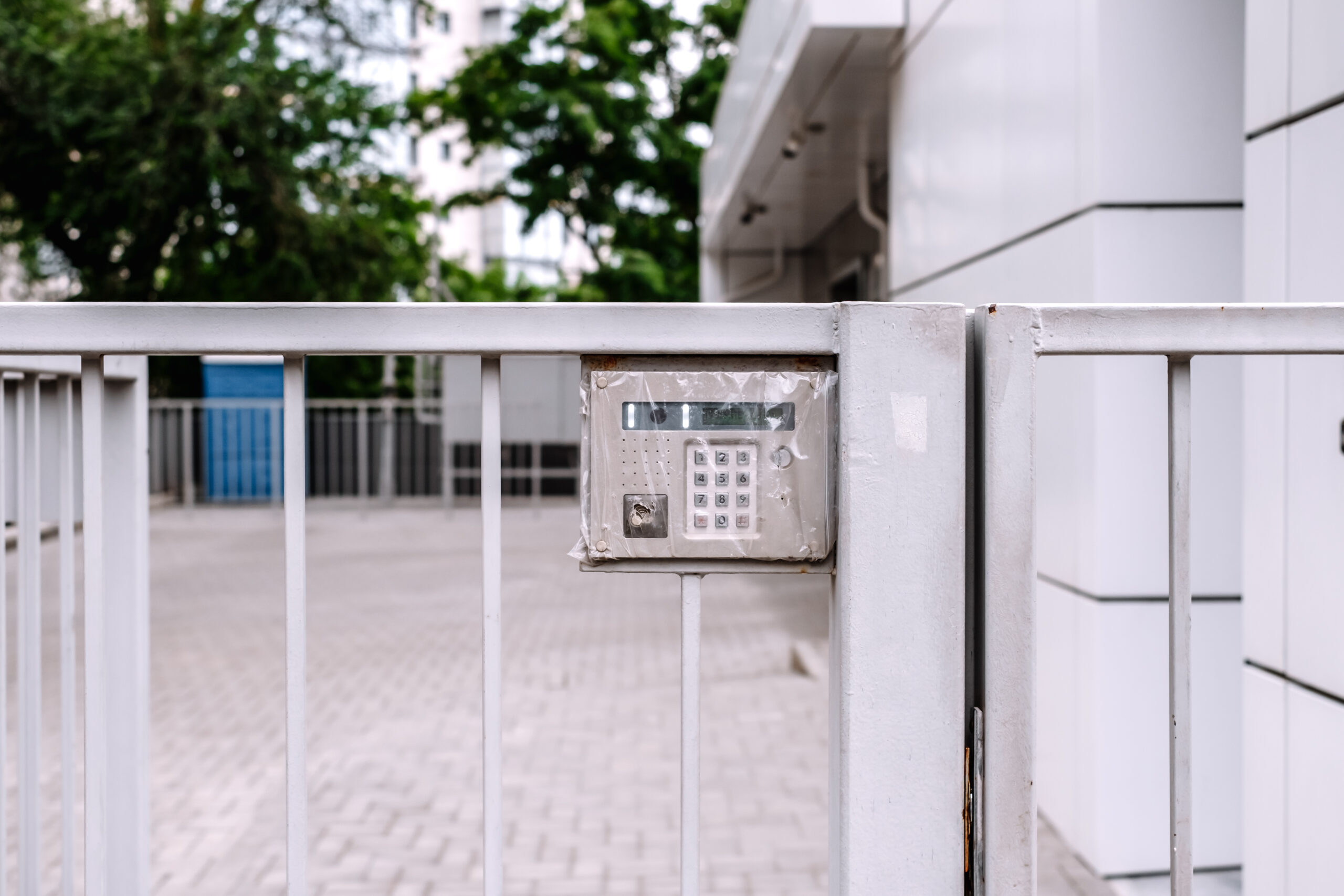 Intercom on the fence of a new building.
